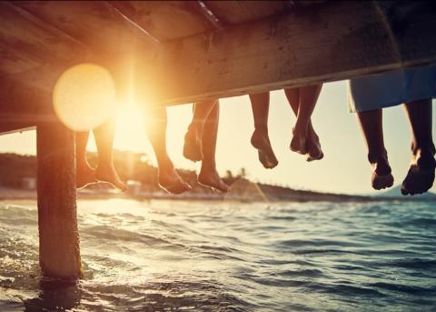 people sitting on dock